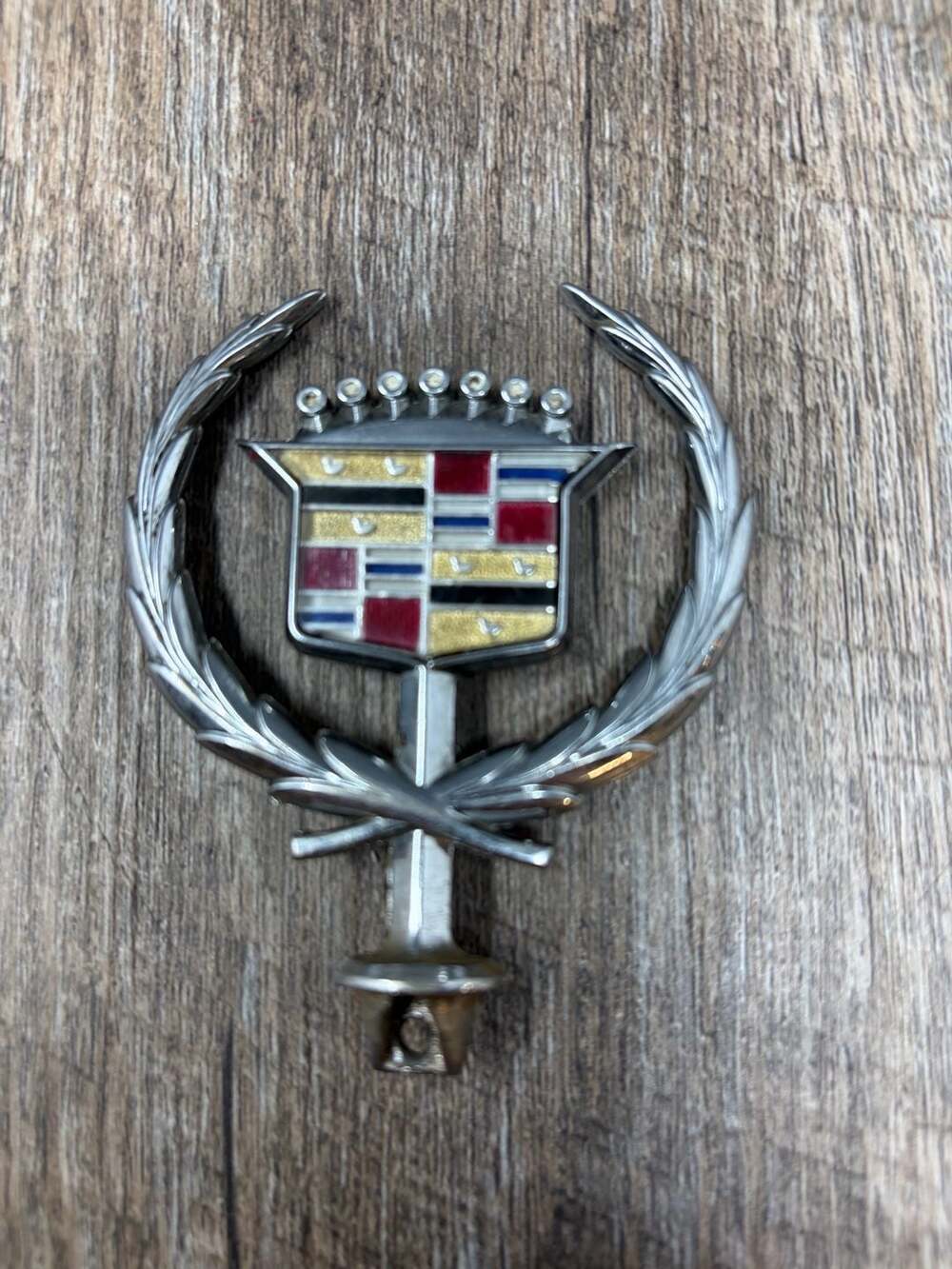 Vintage Iconic GM Cadillac crest and wreath hood ornament emblem with gold birds